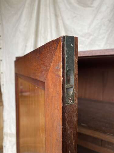 An antique 19th century three section teak campaign chest on chest with cupboard