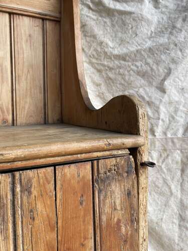 A rare antique 19th century vernacular pine Irish settle bed
