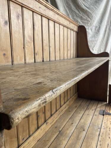 A rare antique 19th century vernacular pine Irish settle bed