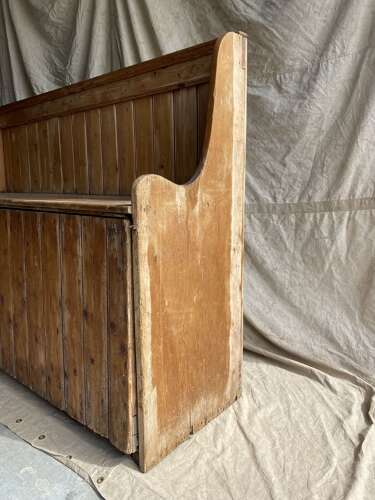A rare antique 19th century vernacular pine Irish settle bed