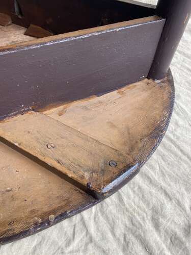 An antique 19th century pine cricket table