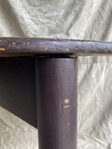An antique 19th century pine cricket table