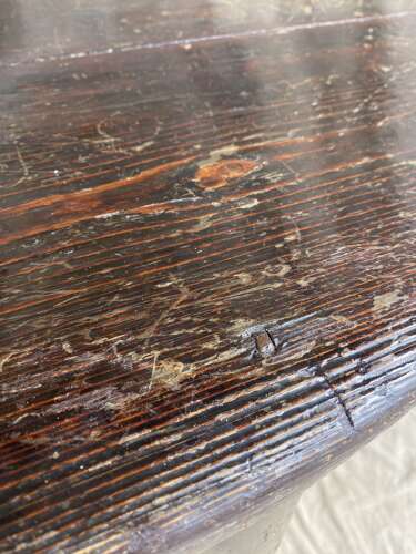 An antique 19th century pine cricket table