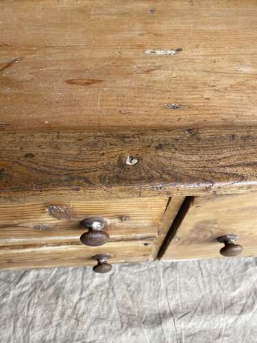 An antique early 19th century West Country pine and elm panel back settle