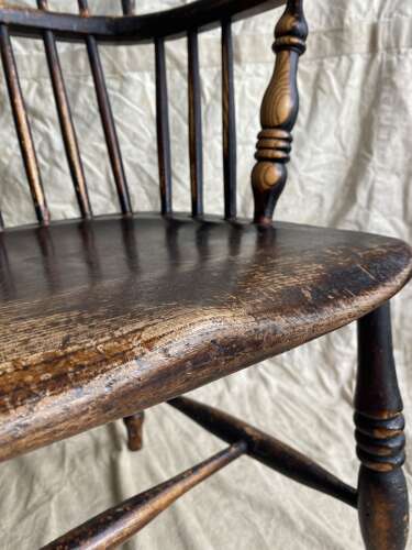 An antique 19th century elm and ash hoop and stick back Windsor chair