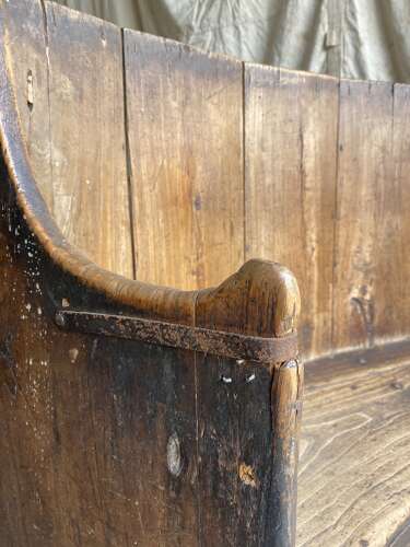 A rare antique 17th century James II elm barrel back tavern settle