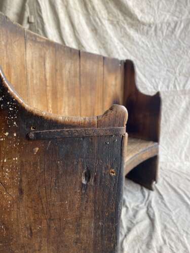 A rare antique 17th century James II elm barrel back tavern settle