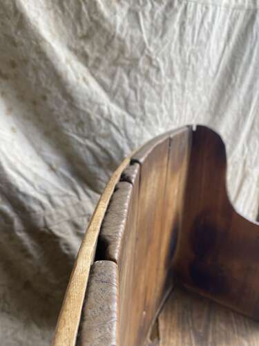 A rare antique 17th century James II elm barrel back tavern settle