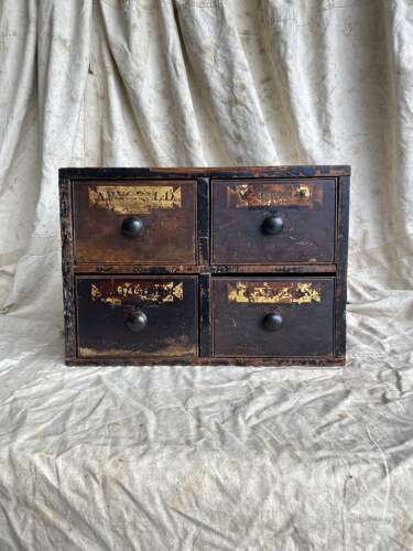 A bank of antique early 19th century mahogany and pine apothecary drawers