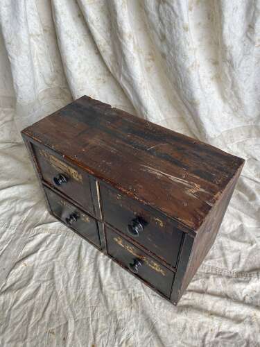 A bank of antique early 19th century mahogany and pine apothecary drawers