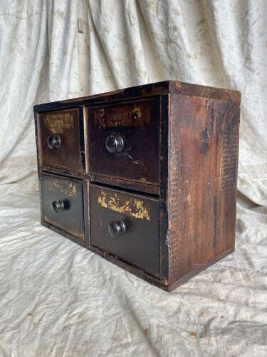 A bank of antique early 19th century mahogany and pine apothecary drawers