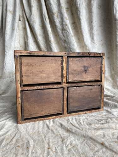 A bank of antique early 19th century mahogany and pine apothecary drawers