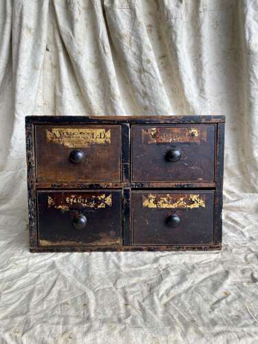 A bank of antique early 19th century mahogany and pine apothecary drawers