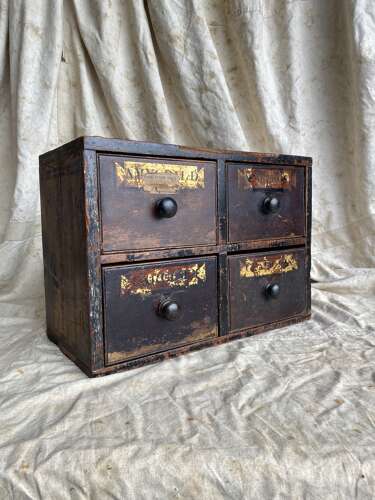 A bank of antique early 19th century mahogany and pine apothecary drawers