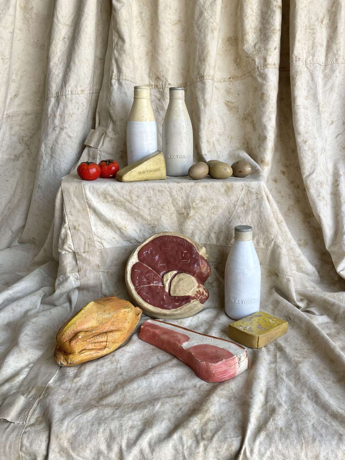 A collection of vintage 1950s Electrolux shop advertising display food