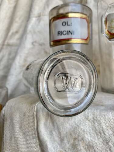 A large collection of antique Victorian glass apothecary chemist bottles
