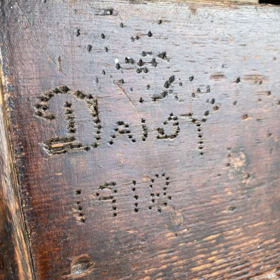 An antique early 20th century Welsh 'Daisy' rustic pine milking stool