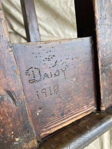 An antique early 20th century Welsh 'Daisy' rustic pine milking stool