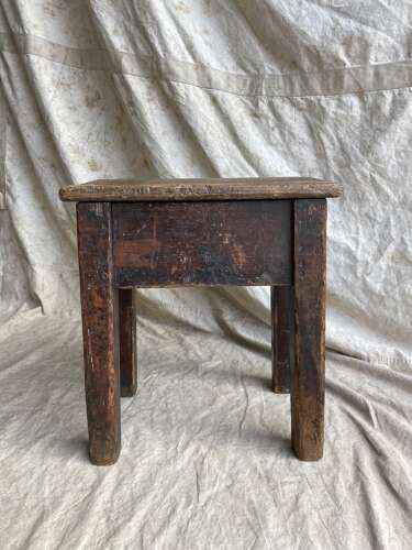 An antique early 20th century Welsh 'Daisy' rustic pine milking stool