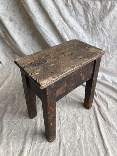 An antique early 20th century Welsh 'Daisy' rustic pine milking stool