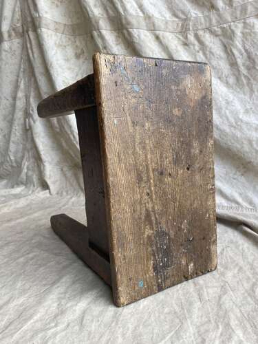 An antique early 20th century Welsh 'Daisy' rustic pine milking stool