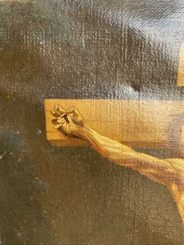 An antique 19th century oil painting of the crucifixion