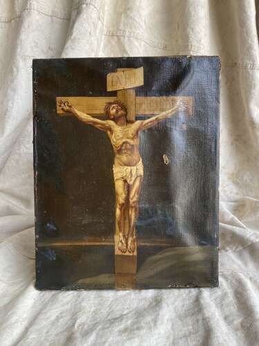An antique 19th century oil painting of the crucifixion