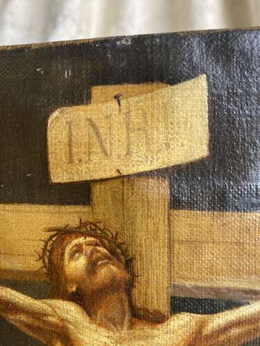 An antique 19th century oil painting of the crucifixion