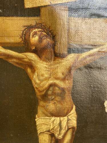 An antique 19th century oil painting of the crucifixion