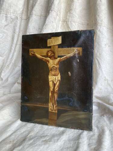 An antique 19th century oil painting of the crucifixion