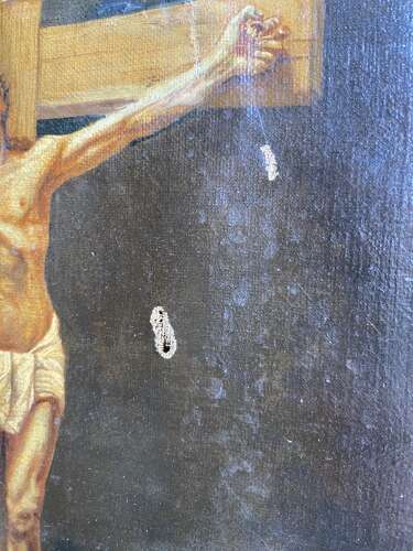 An antique 19th century oil painting of the crucifixion