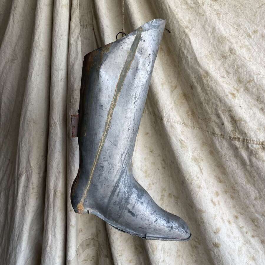 An antique early 20th century English bootmakers metal trade sign