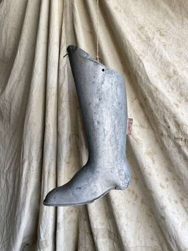 An antique early 20th century English bootmakers metal trade sign
