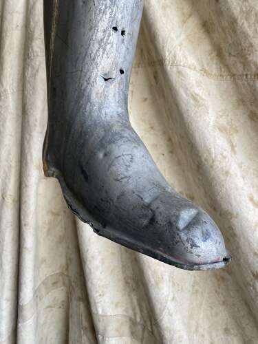 An antique early 20th century English bootmakers metal trade sign