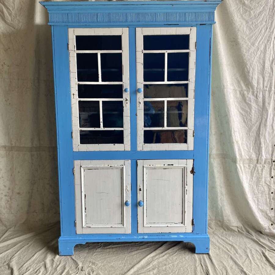 A large antique 19th century Irish glazed painted pine kitchen cupboard