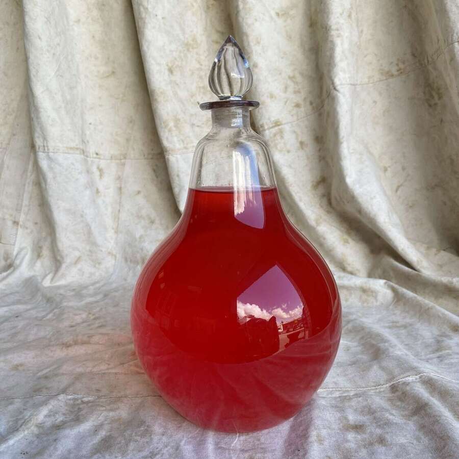 A Victorian apothecary hand blown antique chemist shop glass carboy