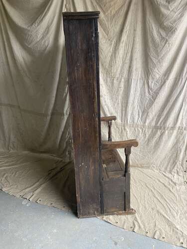 A charming antique English 18th century oak bacon back settle of small proportions