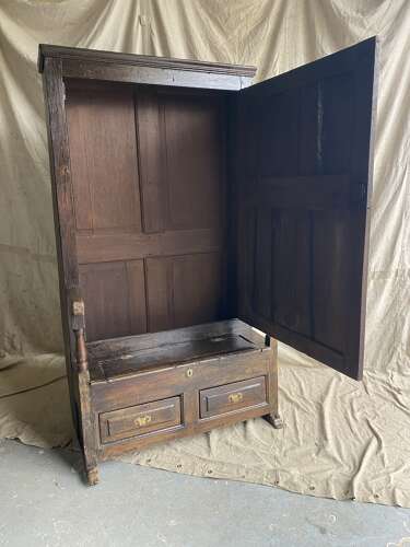 A charming antique English 18th century oak bacon back settle of small proportions