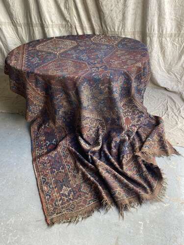 A large antique Persian late 19th century hand knotted Qashqai Khamseh rug