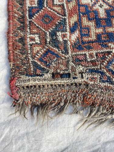 A large antique Persian late 19th century hand knotted Qashqai Khamseh rug