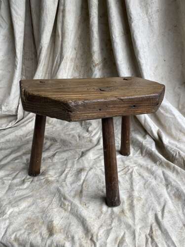 A rustic antique 19th century Welsh pine dairy stool