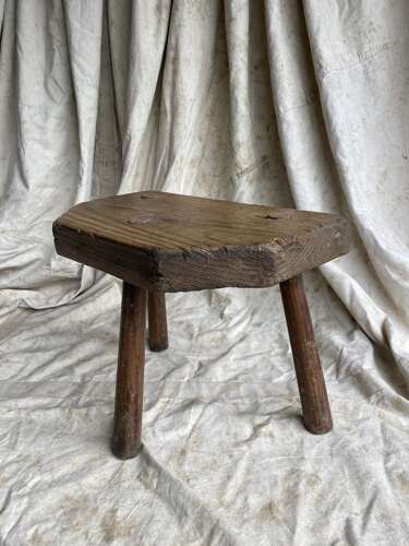 A rustic antique 19th century Welsh pine dairy stool
