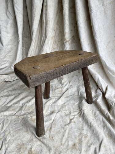 A rustic antique 19th century Welsh pine dairy stool