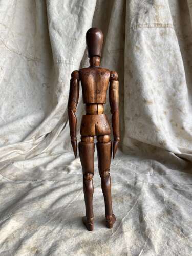 An antique early 20th century Italian wooden artist's articulated lay figure mannequin