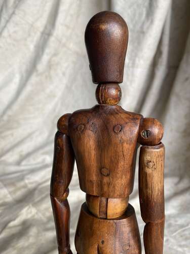 An antique early 20th century Italian wooden artist's articulated lay figure mannequin