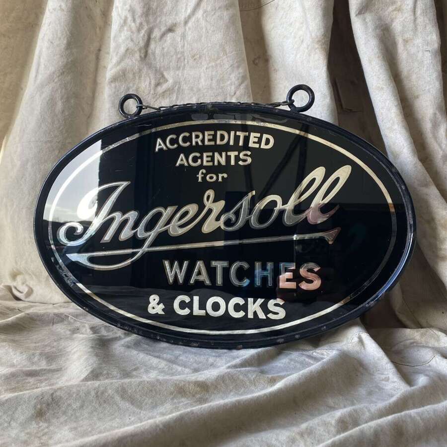 An early 20th century antique double sided glass advertising sign for Ingersoll watches