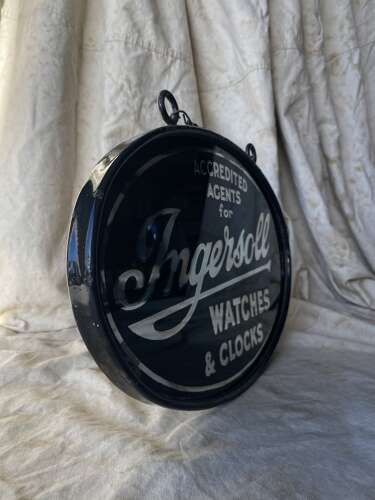 An early 20th century antique double sided glass advertising sign for Ingersoll watches