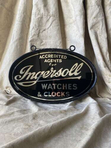 An early 20th century antique double sided glass advertising sign for Ingersoll watches