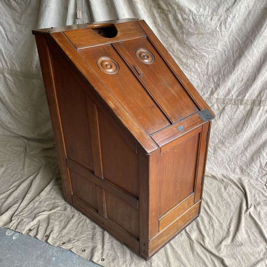 An antique Irish 19th century pine hot steam sauna chair by Ellis and Co