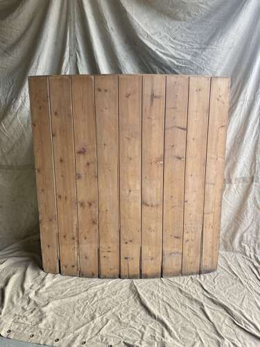 An antique 19th century pine barrel back settle